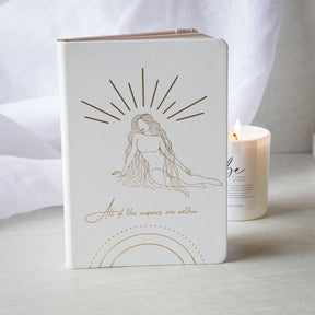 white journal with candle